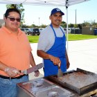 Volunteers Jesus Carrillo and Anthony Rodriguez cook up some spicy carne asada for visitors during Sunday's MIQ Fall Festival.